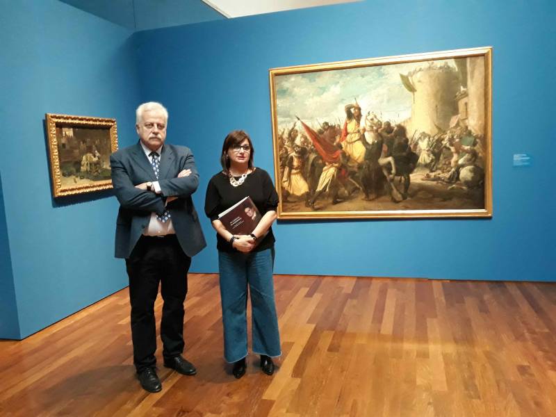 Tatiana Planes, Eva Sanchis y Maria Josep Amigó con la pintura de Ferriol // Foto: M. Pazos